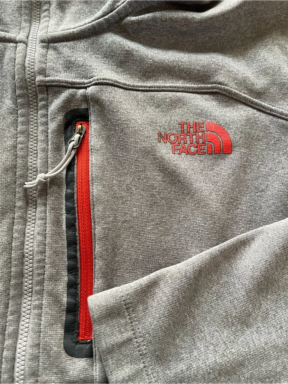 The North Face Men's Hooded Lightweight Jacket in Light Gray with Orange Accents